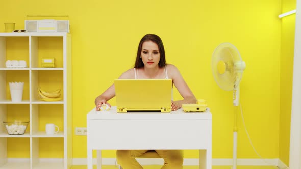 Emotional Woman Works at Laptop