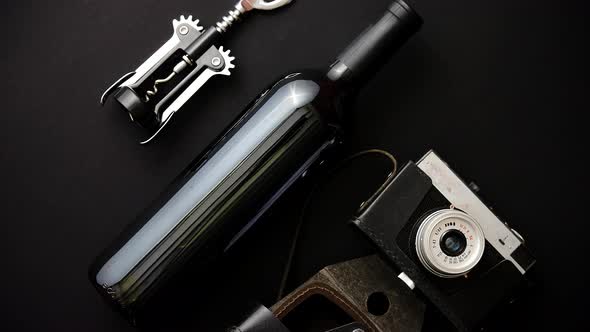 Red Wine Bottle, Corkscrew and Old Photo Camera