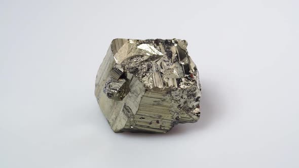Natural Pyrite Rough Gemstone on the Background