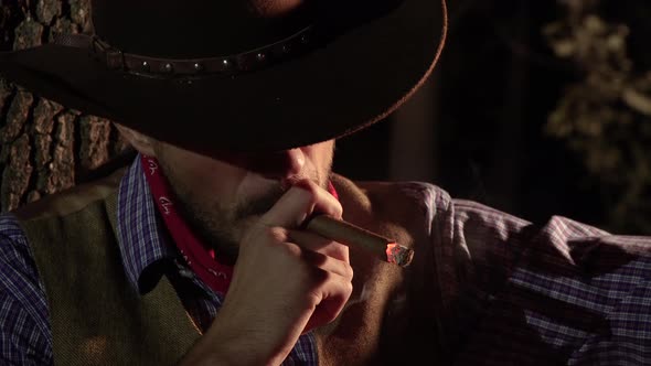 Cowboy with a Cigar in the Forest at Night