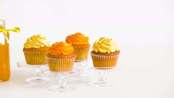 Cupcakes and Lemonade or Juice in Glass Bottles