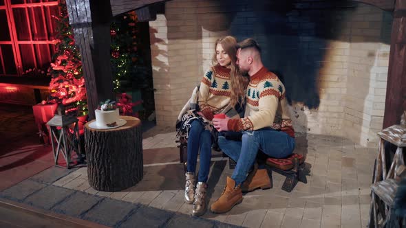 Couple in love in cozy Christmas house. 