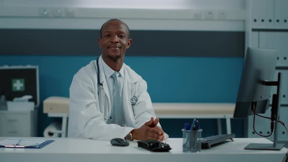 Portrait of African American Doctor with White Coat and Stethoscope