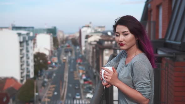 Girl Watching a Beautiful Urban View and Street and Relaxing Alone