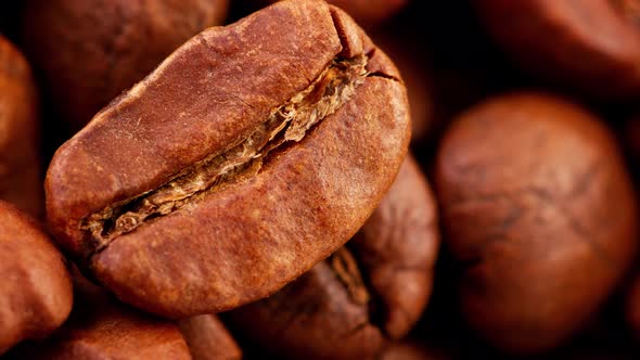 Closeup of Large Roasted Coffee Beans Slow Rotation