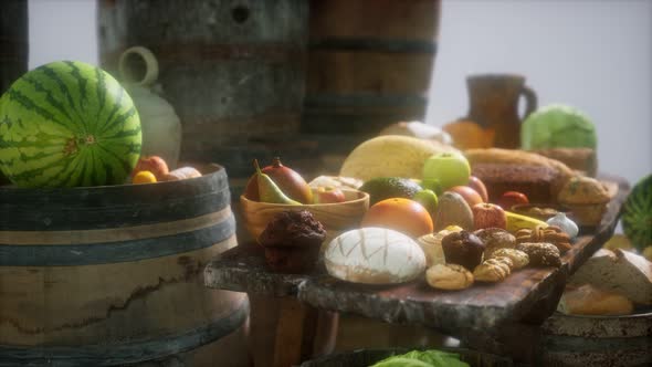 Food Table with Wine Barrels and Some Fruits Vegetables and Bread alt