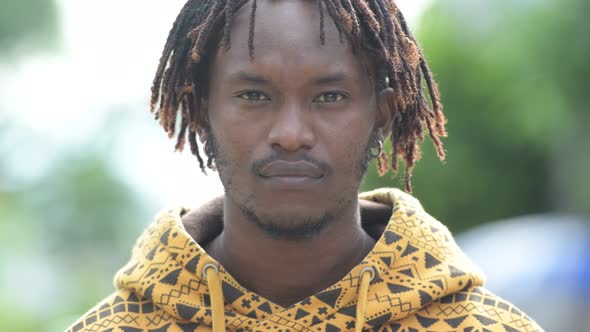 Young Handsome African Man in the Streets Outdoors