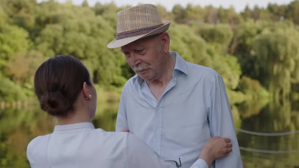 Slow Motion of Happy Granddaughter is Giving an Effective Hug to Her Grandfather As a Sign of Love