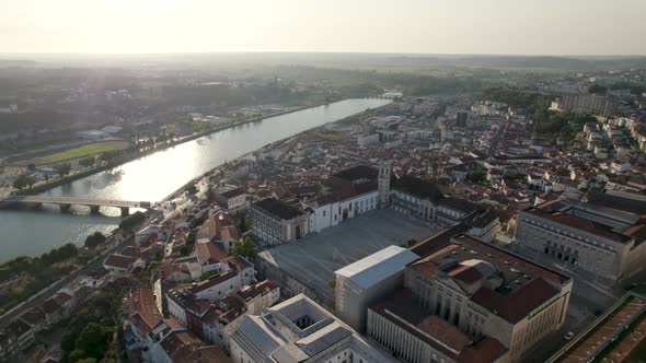 Aerial forward over Coimbra University and Mondego river in background, Portugal