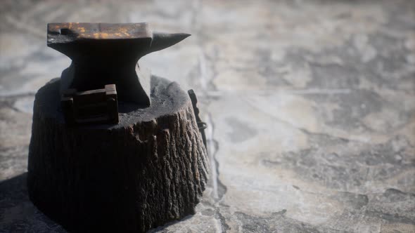 Old Anvil Attached To a Stump