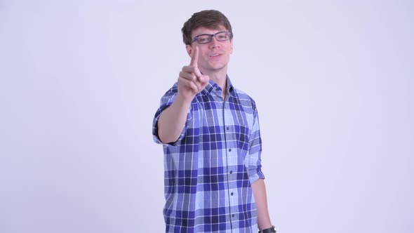 Happy Young Handsome Hipster Man Pointing at Camera