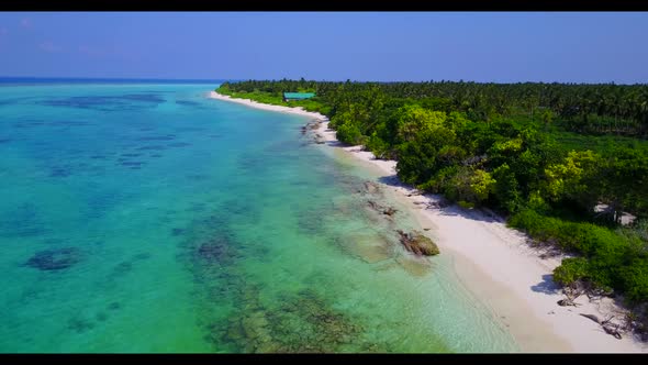 Aerial above landscape of idyllic resort beach time by blue ocean with white sand background of a da