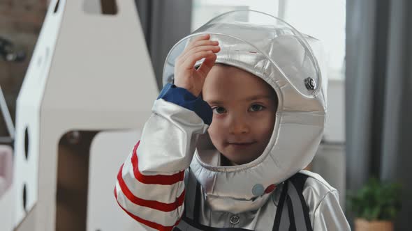 Little Girl in Spacesuit Looking at Camera