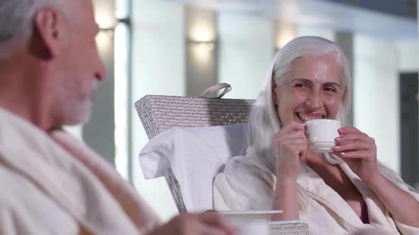 Positive Elderly Couple Relaxing in Spa Hotel