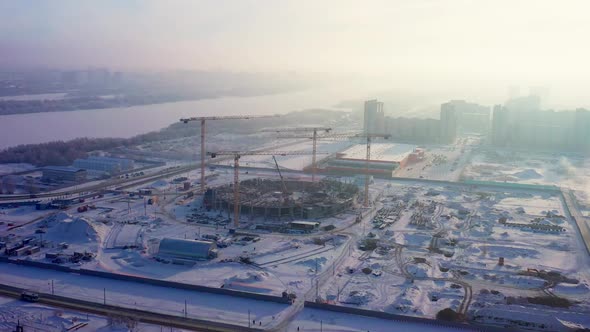 Open Construction Site of Sports Arena and Tower Cranes