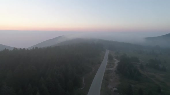 Couple Running On Road And Over The Clouds Aerial View