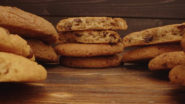 Macro Zoom in Video of Crispy Oat Cookies on Wooden Board in Kitchen