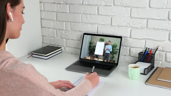 Woman Study at Home Online Video Call Laptop Writes in Notebook Listen Teacher