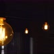 Big Vintage Incandescent Light Bulbs Hanging in the Dark Kitchen - VideoHive Item for Sale