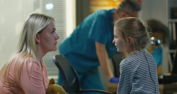 Mother Encouraging Daughter in a Hospital