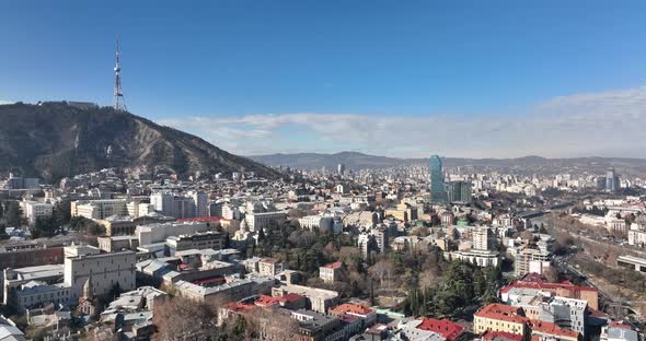 Tbilisi, Georgia - February 1, 2022: Aerial view of center of Tbilisi under Mtatsminda mountain.