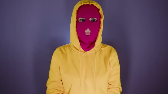 Portrait of Young Woman in Pink Balaclava