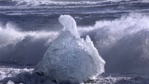 Ice From a Glacier Washing By Atlantic Ocean Waves on a Black Diamond Beach in Iceland. Climate