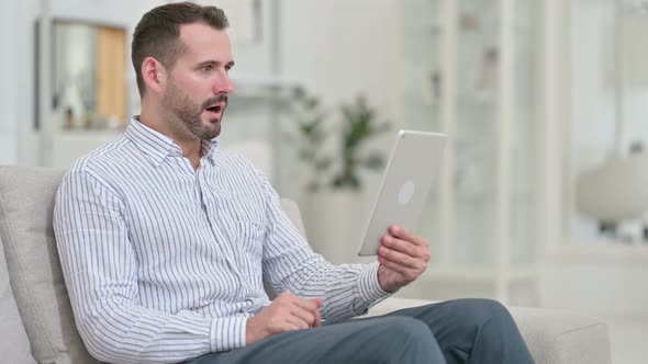 Failure, Young Man with Loss on Tablet at Home 