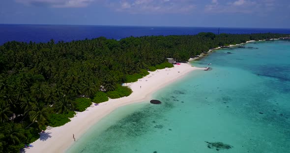 Luxury drone island view of a white sand paradise beach and blue water background in colorful 4K