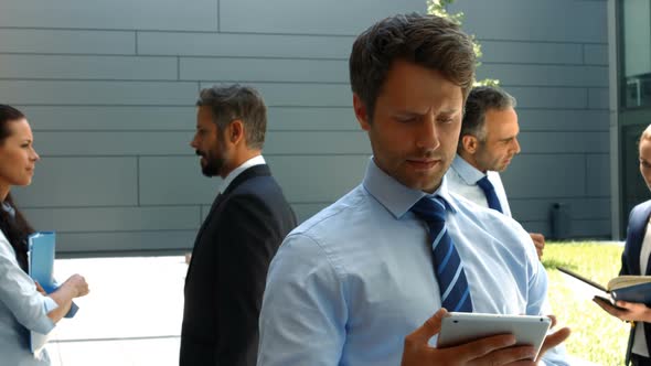 Businessman using digital tablet in office