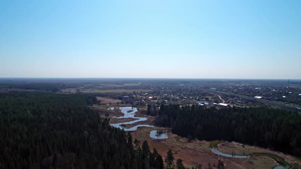 View From the Top of a Countryside Valley with a Village a Forest and a River