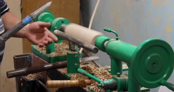 Carpenter turning wood on a lathe