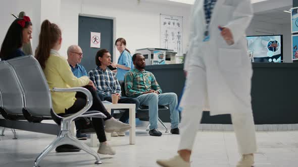 Diverse Group of People Waiting in Hospital Reception Lobby