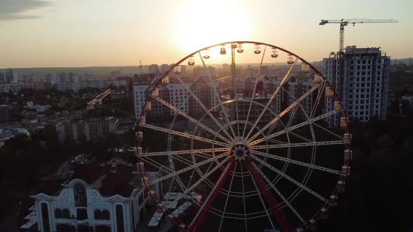 Ferris wheel in city park, aerial sunset, Kharkiv