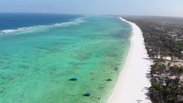 Ocean Coastline Barrier Reef By Beach Hotels at Low Tide Zanzibar Aerial View