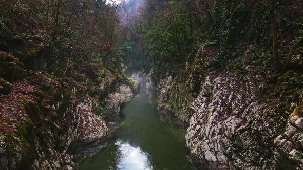 River in a Narrow Canyon with White Rocks