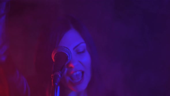 Young Beautiful Woman Sings Song Microphone Stage During Concert