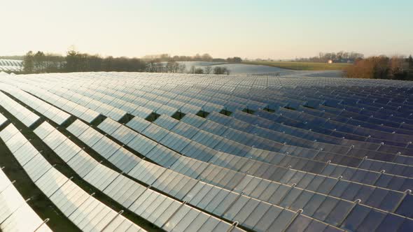 Drone Over Rows And Rows Of Solar Panels In Field