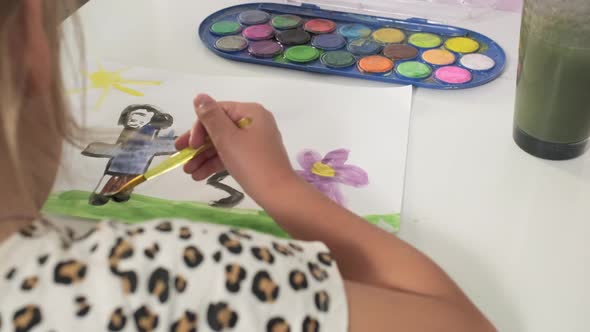 Talented Creative Child Girl Female Artist Draws with Her Hands on Paper Using Fingers Paints Brush