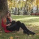 Woman Is Reading Book Lying Under The Tree - VideoHive Item for Sale