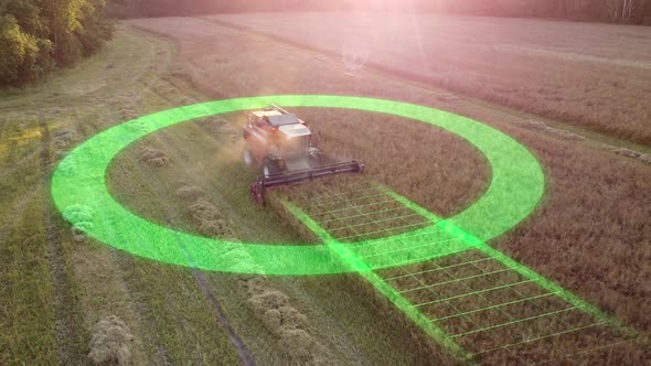 Aerial view of a self-driving autonomous combine harvester harvesting