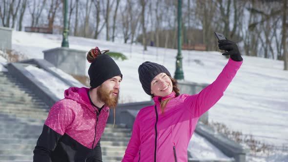 Couple Taking Selfie After Workout in Winter Park