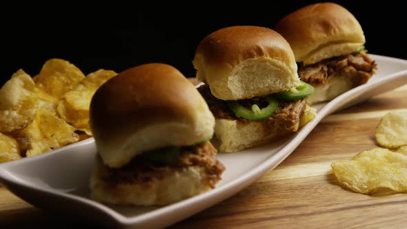 Rotating shot of delicious pulled pork sliders - BBQ 
