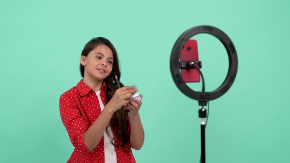 Cheerful Kid Vlogger Use Selfie Led to Do Makeup with Powder and Brush Thumb Up Cosmetics