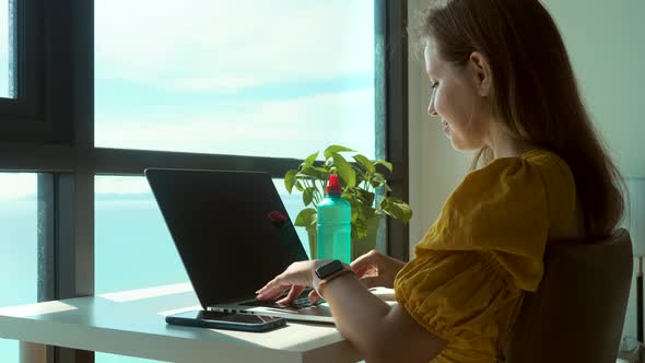 Happy Business Woman Working From Home on Vacation and Enjoy Sea View