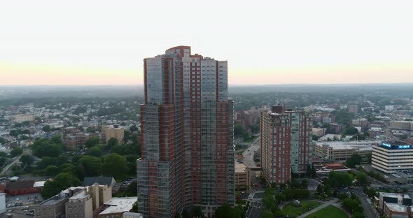 Aerial Pan Around of a High Rise Building in New Rochelle at Sunset