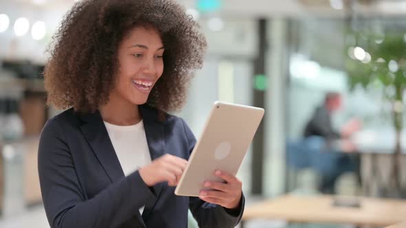 African Businesswoman Talking for Video Chat on Tablet