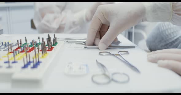 A Dentist's Table Prepared for Work with Dental Instruments Laid Out on It