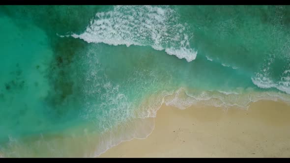 Aerial top view travel of tranquil coast beach time by blue water with white sand background of a pi