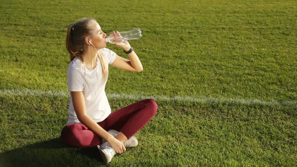 Girl Drinks Water As Resting